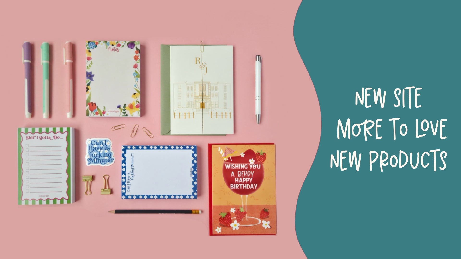 Stationery items including notebooks, pens, and greeting cards on a pink background with text about a new site.